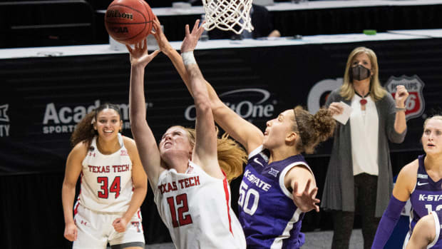 Mar 11, 2021; MO, Kansas City, USA; Kansas State Wildcats center Ayoka Lee (50) blocks a shot by Texas Tech Lady Raiders guard Vivian Gray (12) in the second half at Municipal Auditorium. Mandatory Credit: Amy Kontras-USA TODAY Sports